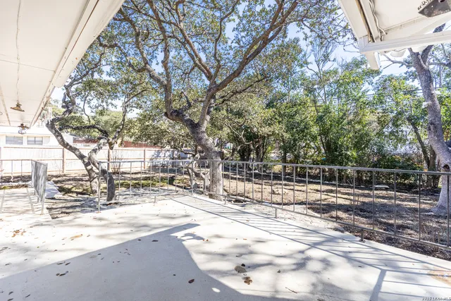 a front view of a house with a large window