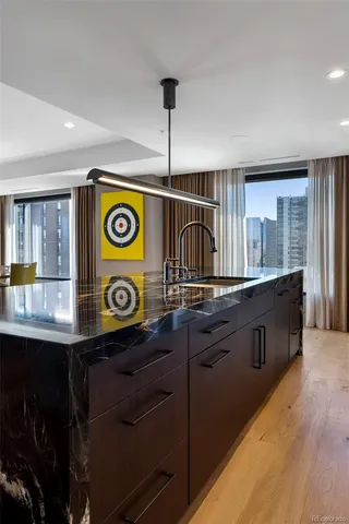 a kitchen with a sink and a stove