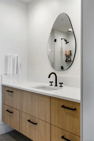 a bathroom with a sink and a mirror