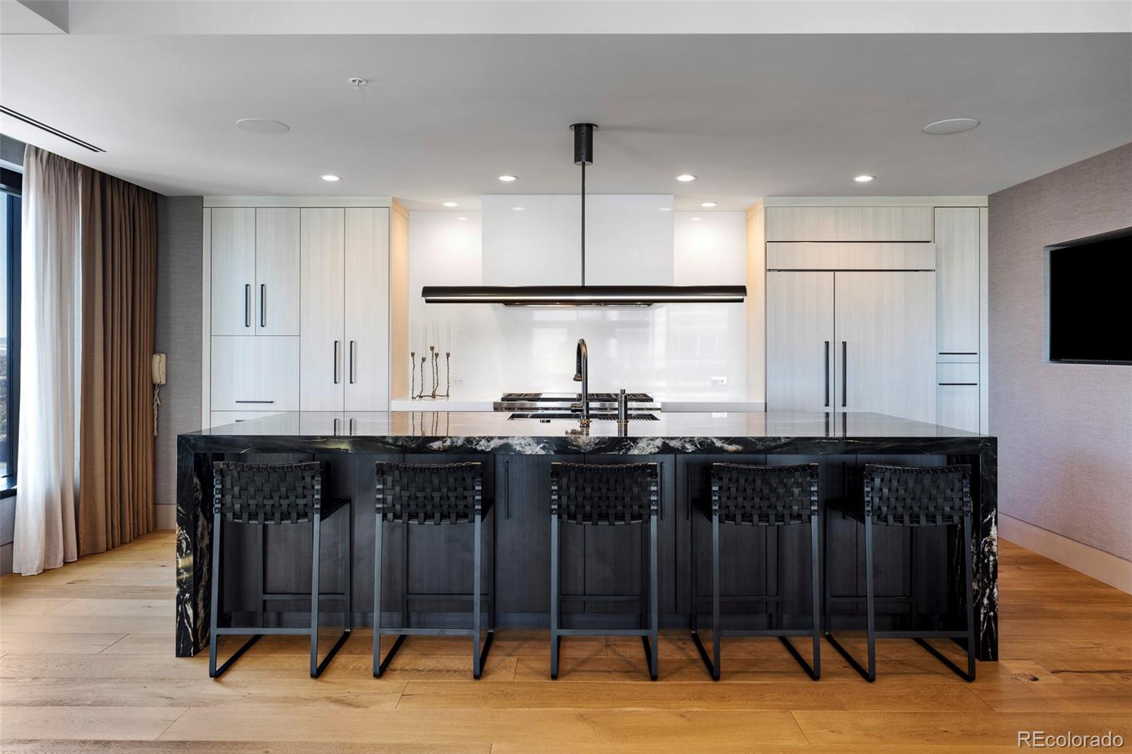 1133 14th Street, Unit 2820 Denver, CO 80202 - Photo 5 of 34 a kitchen with stainless steel appliances granite countertop a sink and a refrigerator