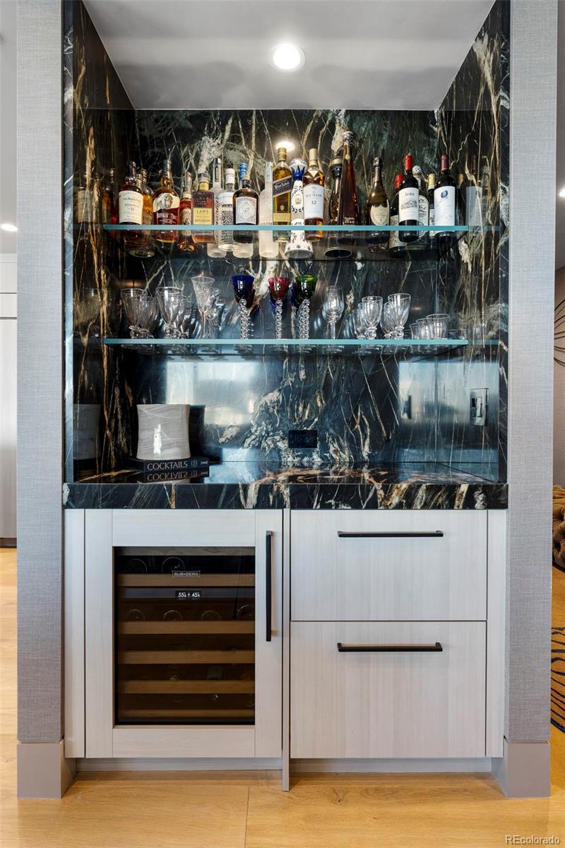 1133 14th Street, Unit 2820 Denver, CO 80202 - Photo 10 of 34 a kitchen with counter top space and wooden floor