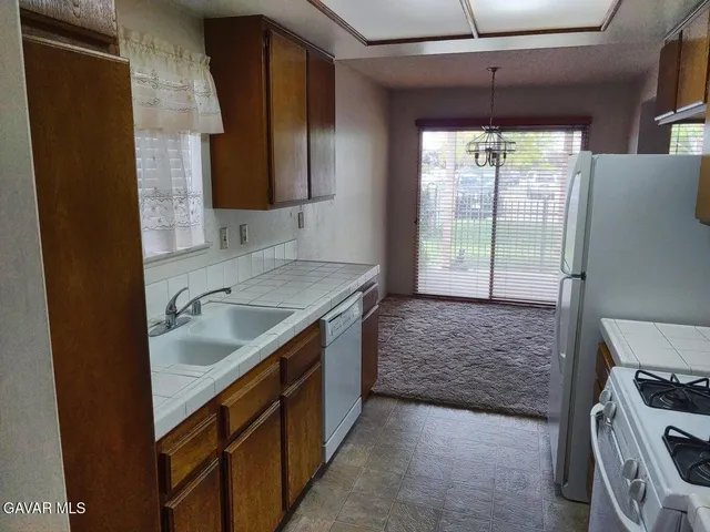 a view of a bathroom from a corridor