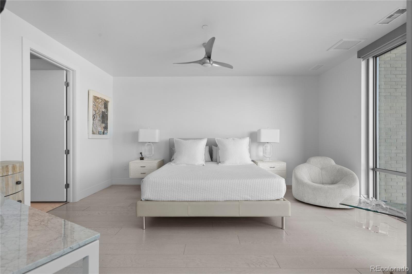 4200 West 17th Avenue, Unit 618 Denver, CO 80204 - Photo 11 of 38 a bedroom with a bed and cabinets