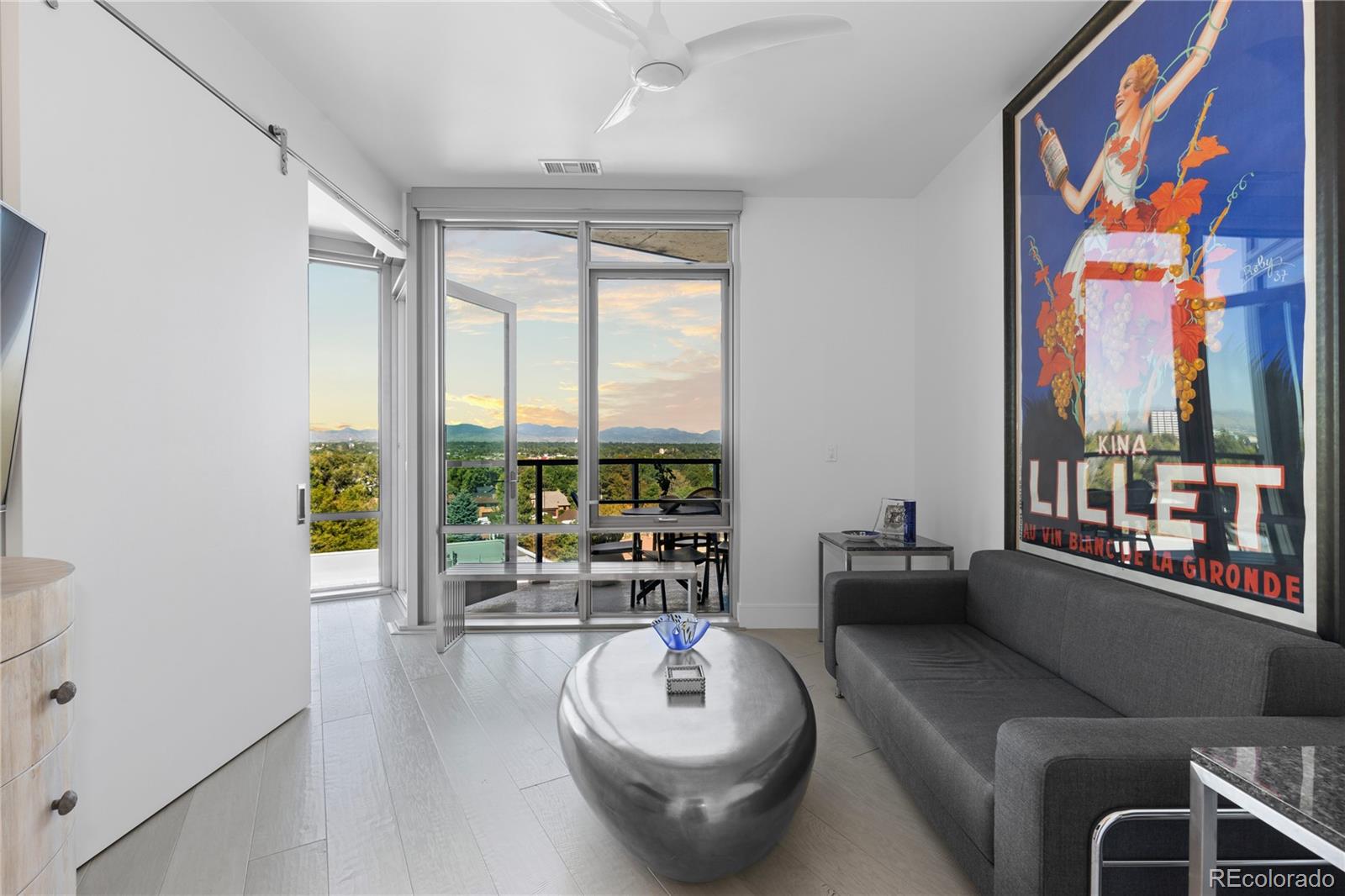 4200 West 17th Avenue, Unit 618 Denver, CO 80204 - Photo 18 of 38 a living room with furniture and a floor to ceiling window