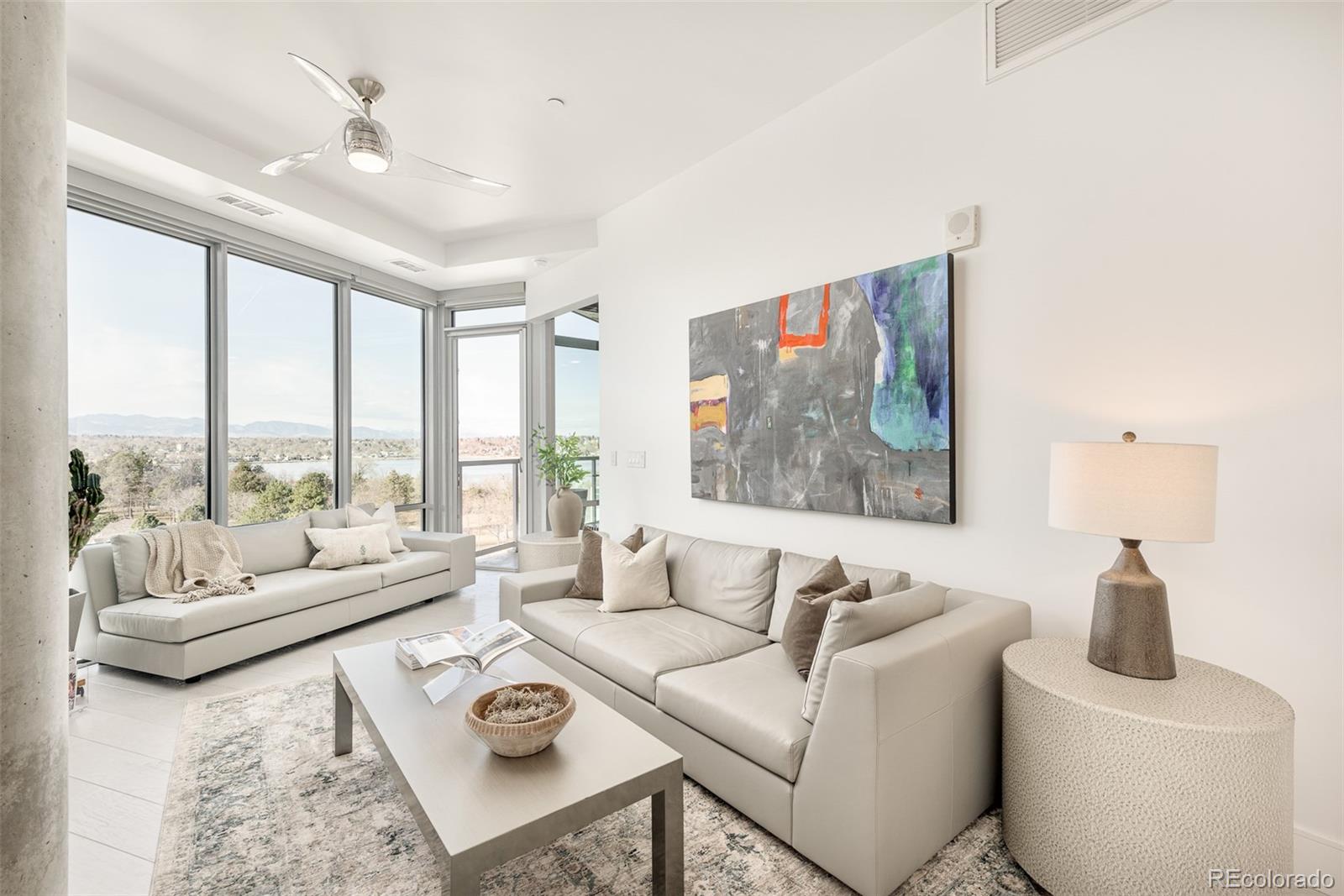 4200 West 17th Avenue, Unit 618 Denver, CO 80204 - Photo 2 of 38 a living room with furniture and a large window