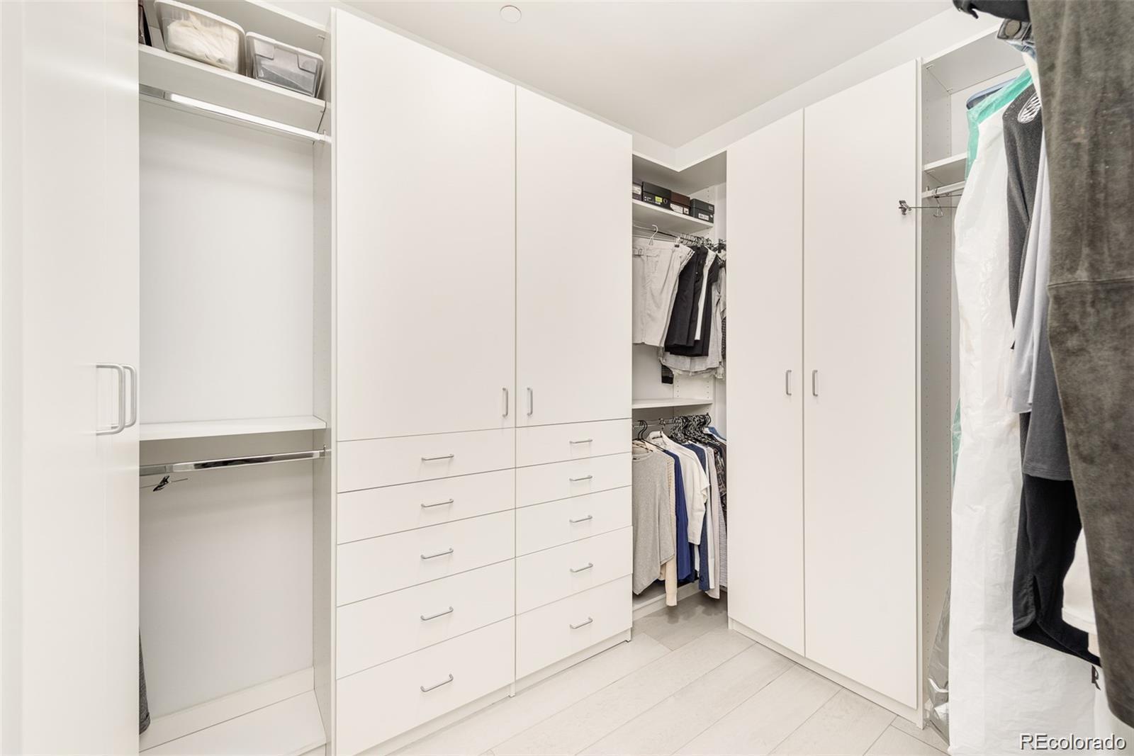 4200 West 17th Avenue, Unit 618 Denver, CO 80204 - Photo 24 of 38 a view of walk in closet with clothes and shoes