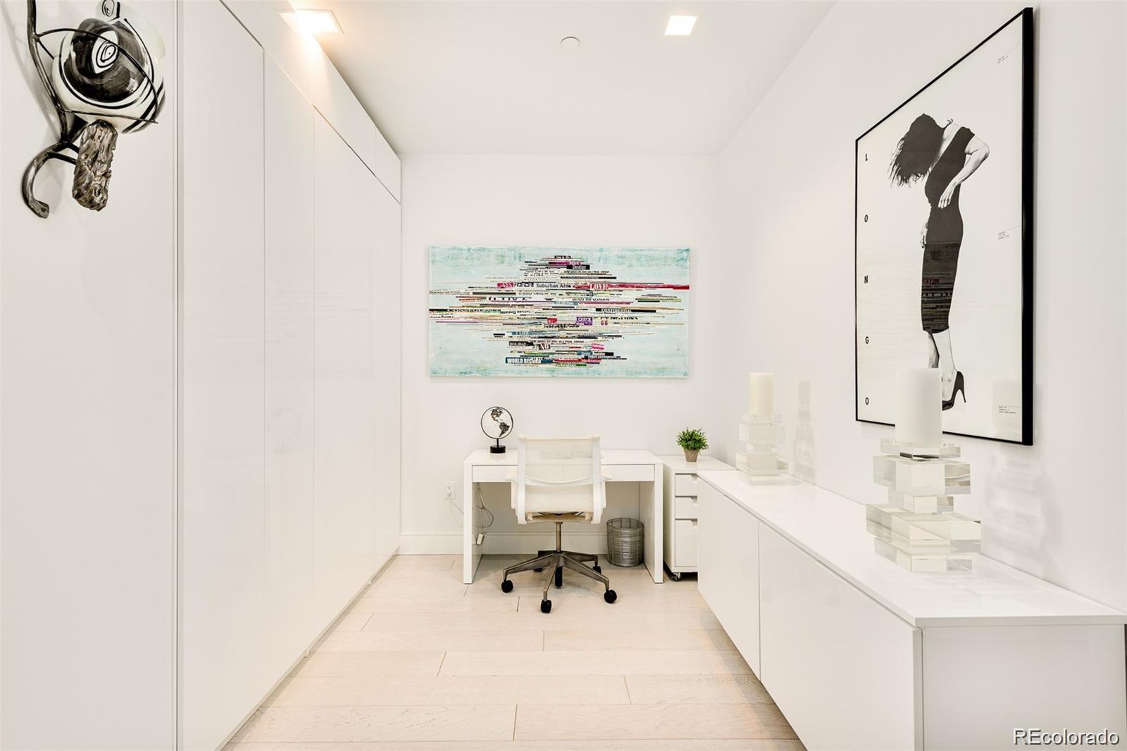 4200 West 17th Avenue, Unit 618 Denver, CO 80204 - Photo 26 of 38 a bathroom with a sink a mirror and a shower