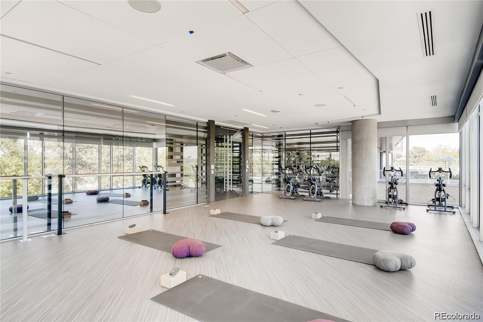 4200 West 17th Avenue, Unit 618 Denver, CO 80204 - Photo 31 of 38 a lobby with furniture and floor to ceiling window