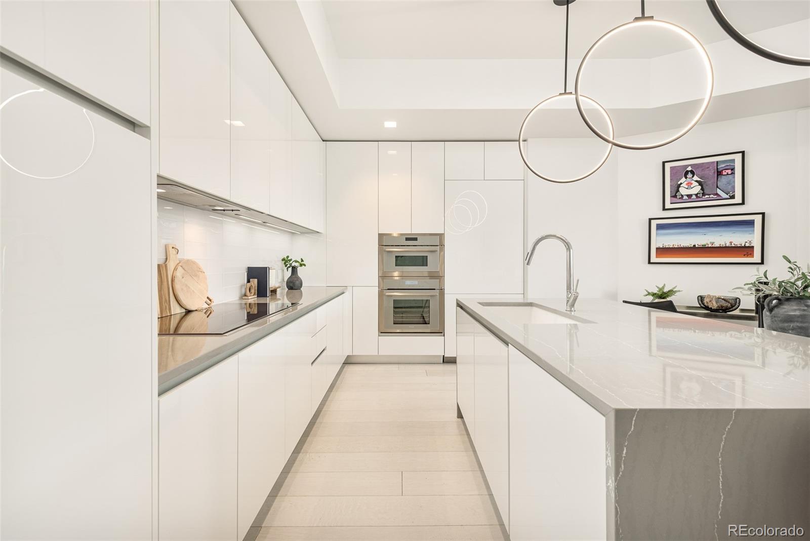 4200 West 17th Avenue, Unit 618 Denver, CO 80204 - Photo 5 of 38 a kitchen with stainless steel appliances a sink a stove and cabinets
