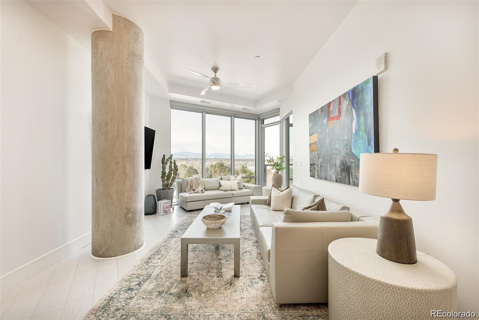 4200 West 17th Avenue, Unit 618 Denver, CO 80204 - Photo 9 of 38 a living room with furniture and a large window