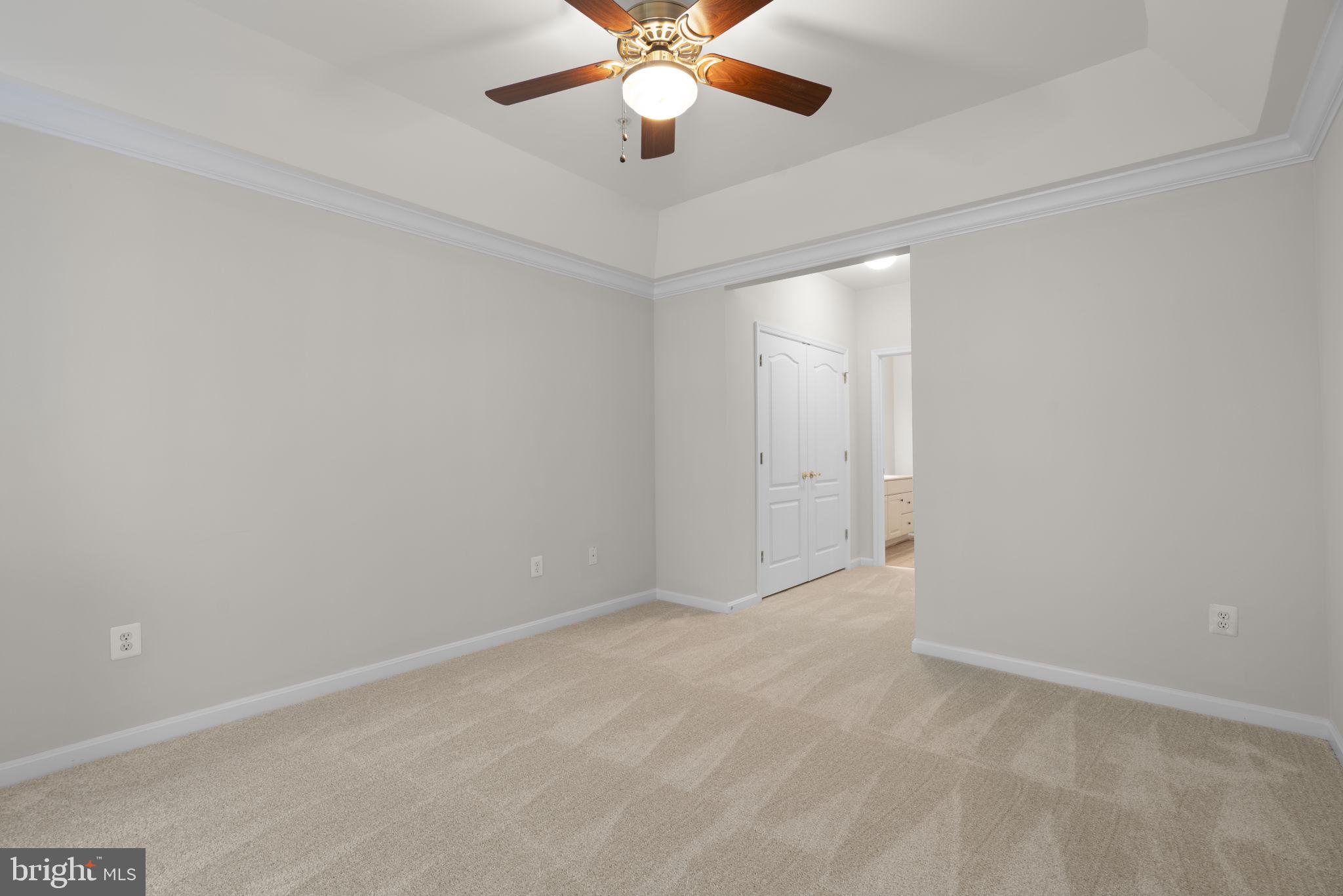 7315 Maplecrest Road, Unit 104 Elkridge, MD 21075 - Photo 25 of 58 en empty room with window and ceiling fan