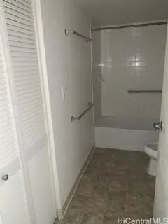 a bathroom with a shower and a bath tub