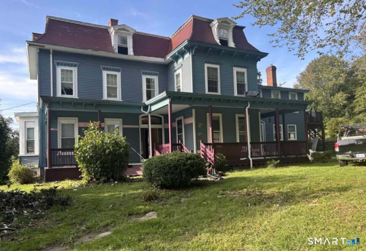 30 Main Street Plainfield, CT 06332 - Photo 1 of 14 a front view of a house with a garden