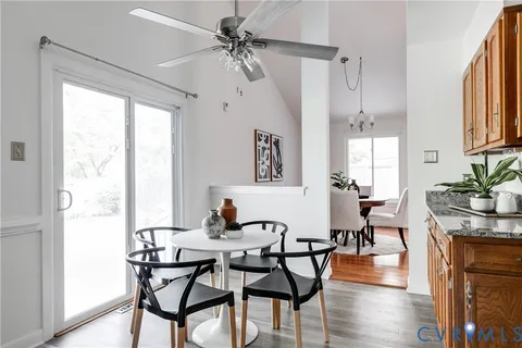 a view of a dining room with furniture window and wooden floor