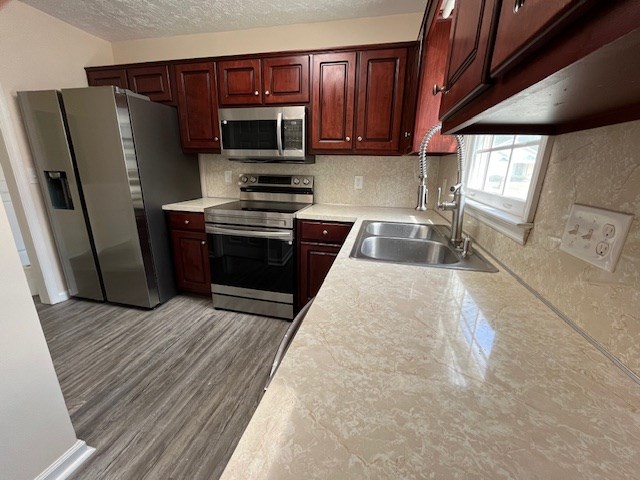 2812 8th Street Columbus, GA 31906 - Photo 4 of 14 a kitchen with granite countertop a refrigerator and a sink