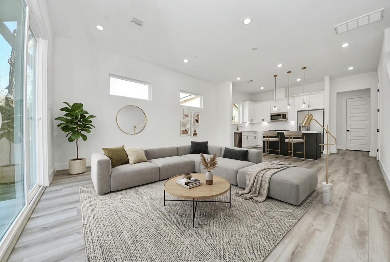 7012 St Augustine Street Houston, TX 77021 - Photo 11 of 45 a living room with furniture kitchen view and a potted plant