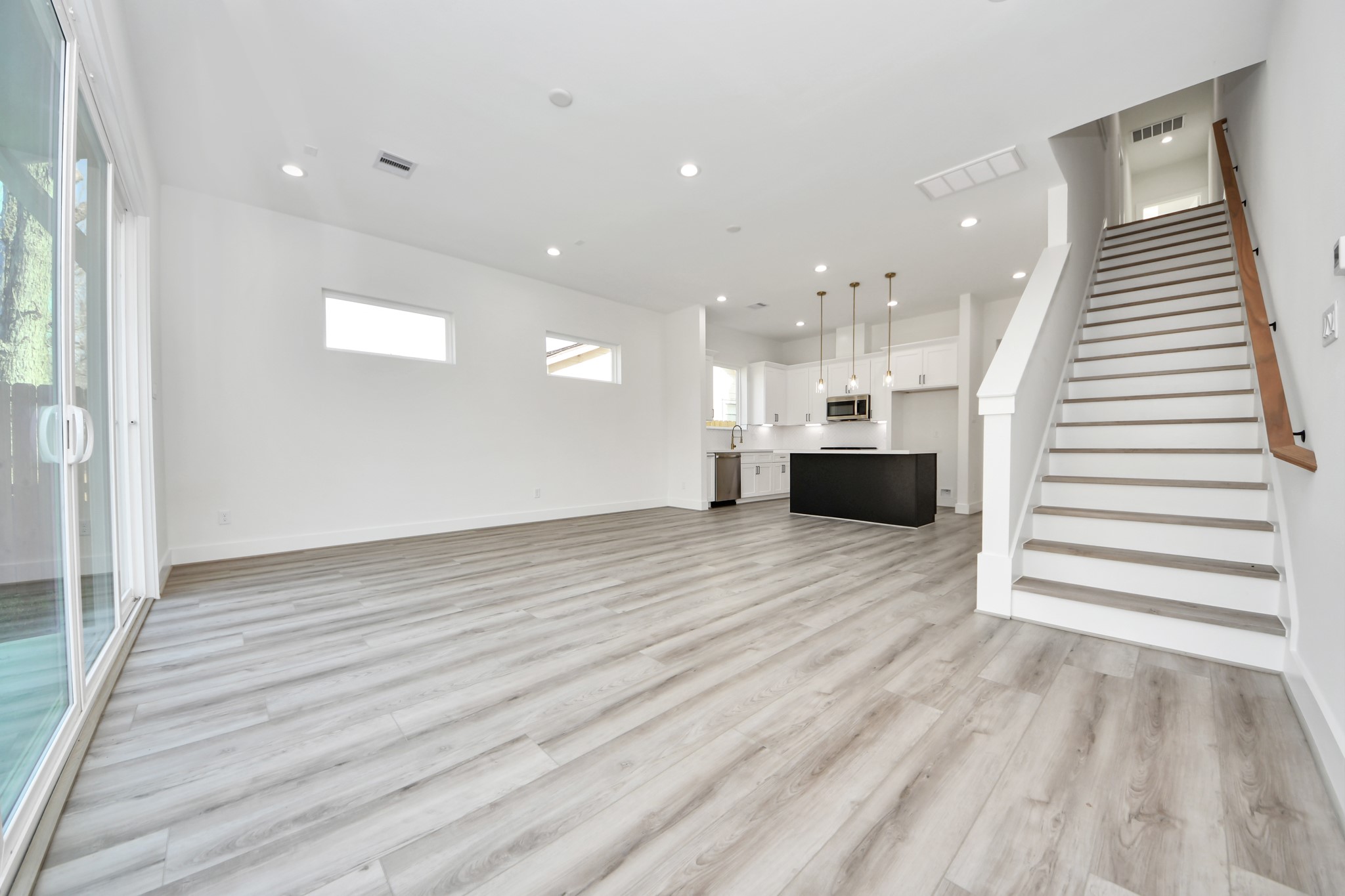 7012 St Augustine Street Houston, TX 77021 - Photo 12 of 45 a view of a hallway with wooden floor