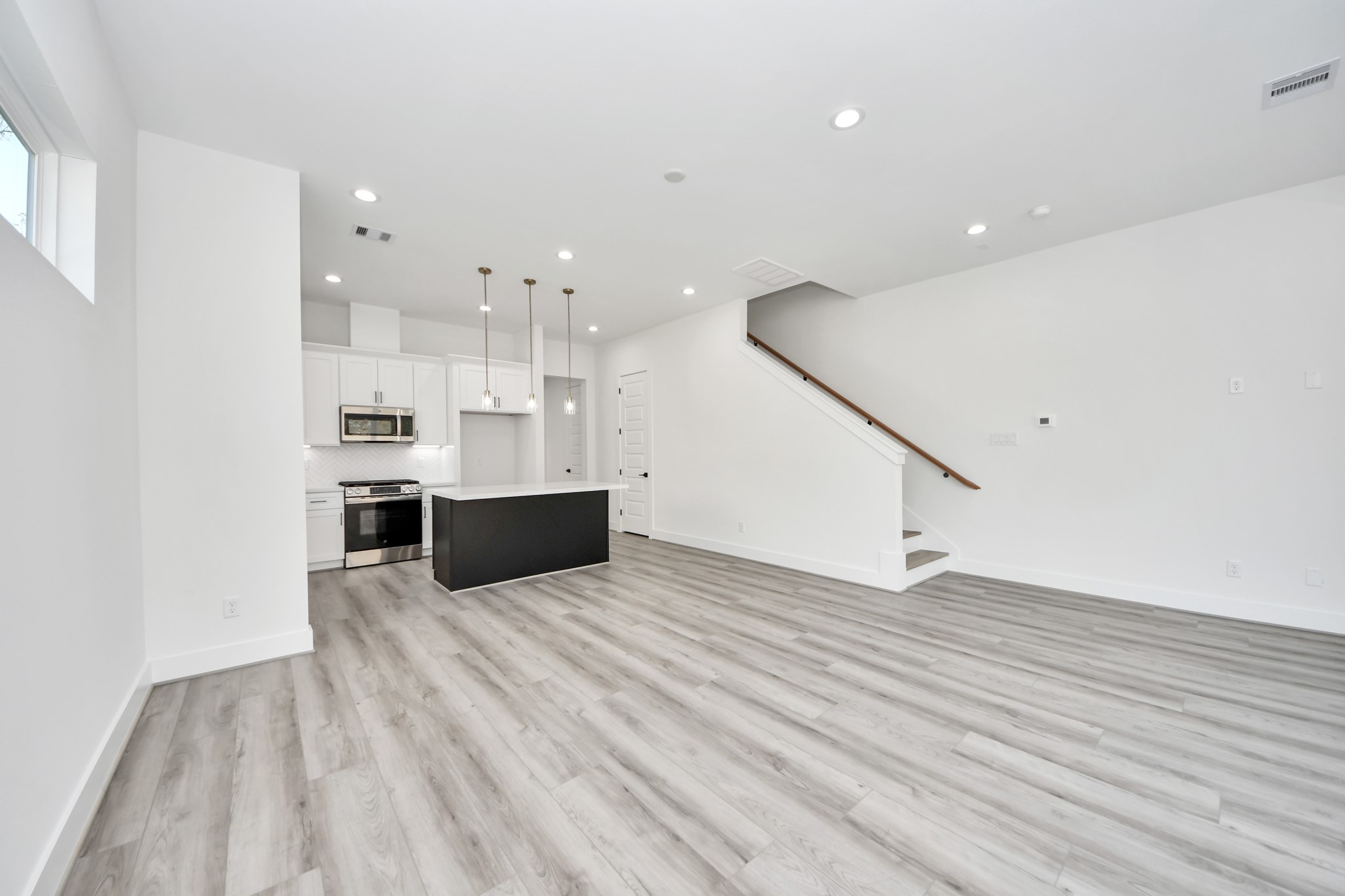 7012 St Augustine Street Houston, TX 77021 - Photo 13 of 45 a view of kitchen with kitchen island stainless steel appliances sink and cabinets