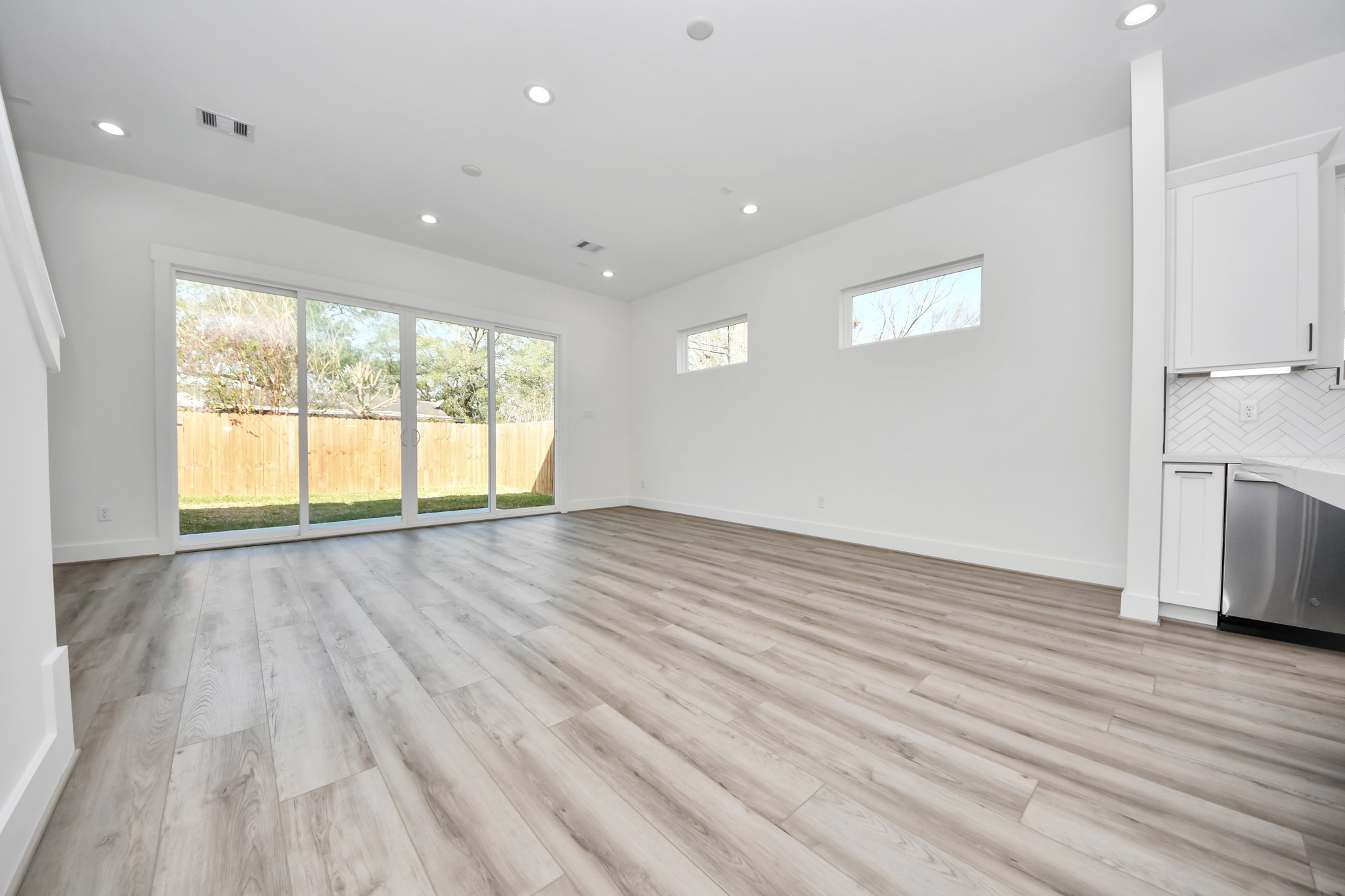 7012 St Augustine Street Houston, TX 77021 - Photo 15 of 45 an empty room with wooden floor and windows