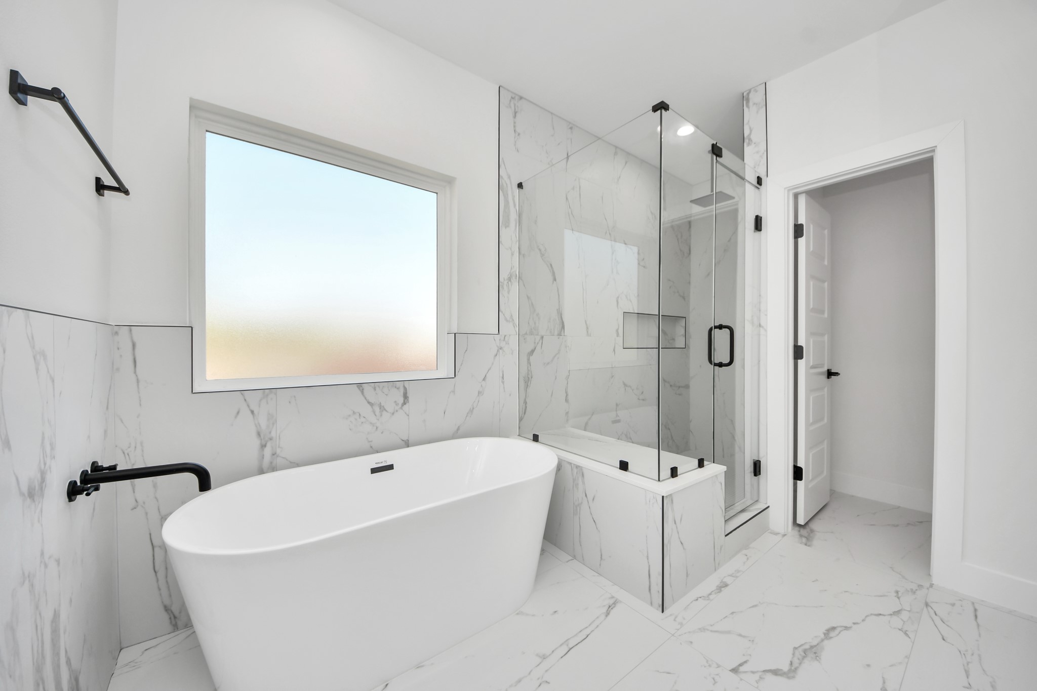 7012 St Augustine Street Houston, TX 77021 - Photo 23 of 45 a white bath tub sitting next to a shower