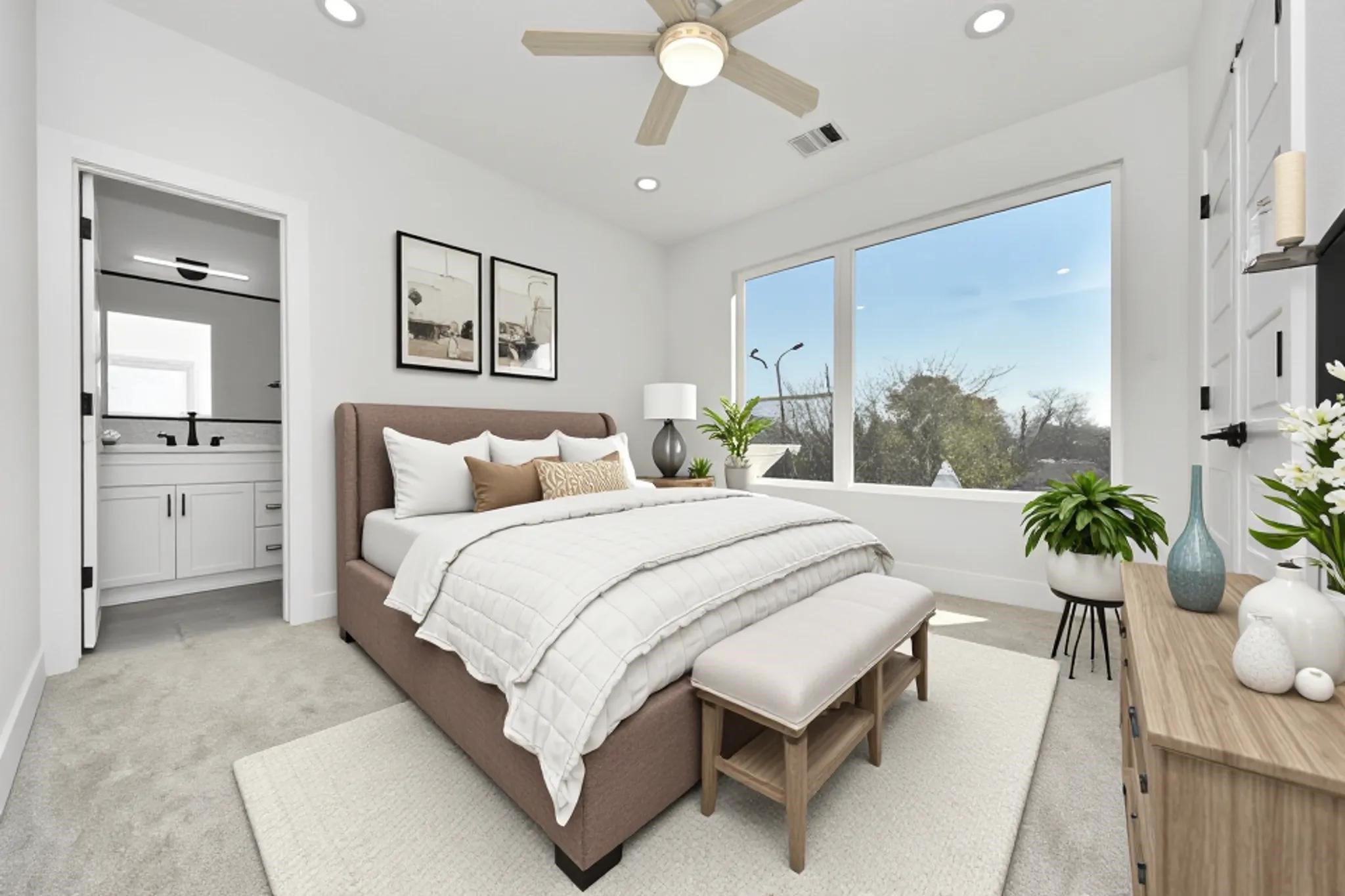 7012 St Augustine Street Houston, TX 77021 - Photo 29 of 45 a spacious bedroom with a bed and a chandelier