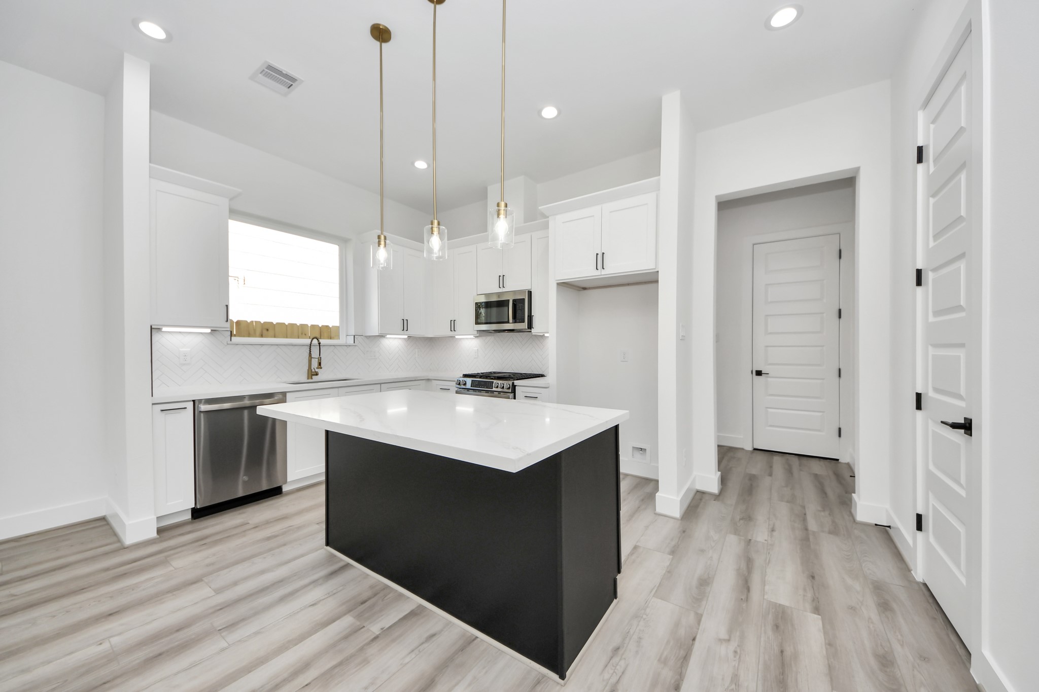 7012 St Augustine Street Houston, TX 77021 - Photo 5 of 45 a kitchen with a sink stove and refrigerator