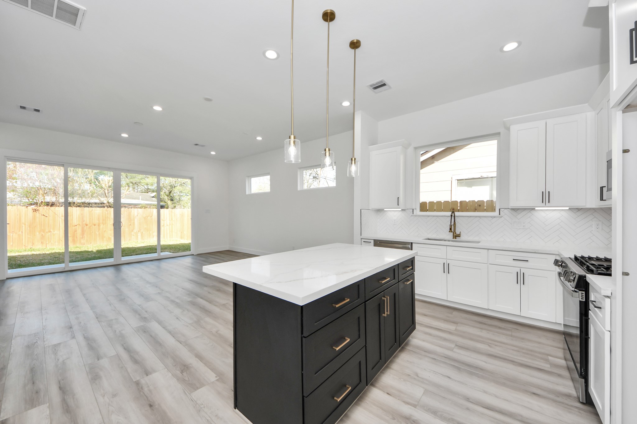 7012 St Augustine Street Houston, TX 77021 - Photo 10 of 45 a kitchen with a wooden floor and window