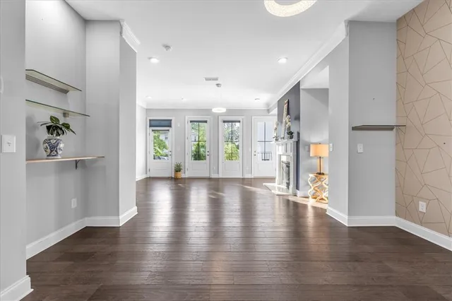 a large kitchen with granite countertop a sink and cabinets