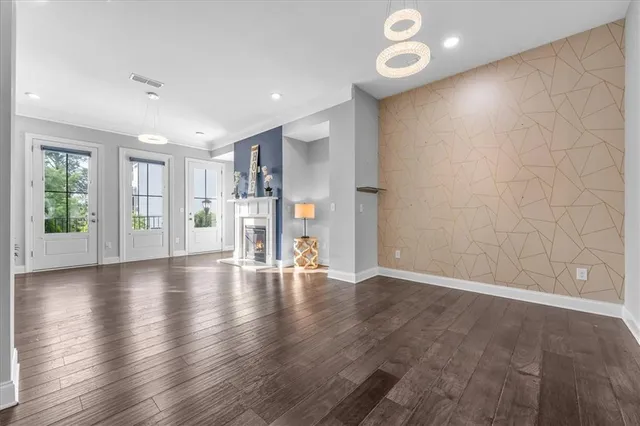 a kitchen with stainless steel appliances granite countertop a sink a stove and a refrigerator