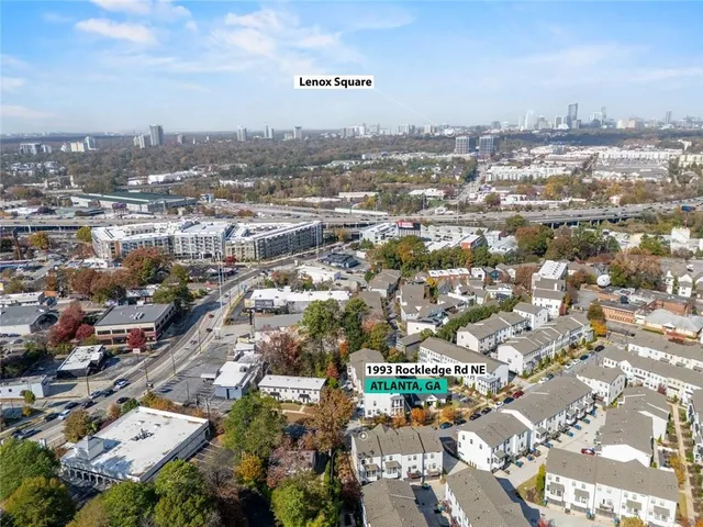 a view of a hallway with wooden floor and stairs