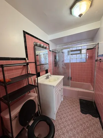 a bathroom with a sink a toilet and bathtub