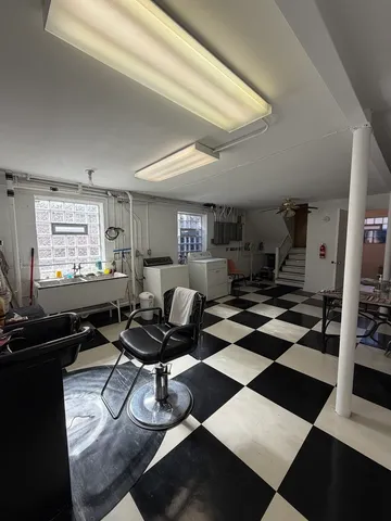 a living room with furniture and a rug