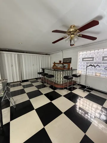 a room with gym equipment and a rug