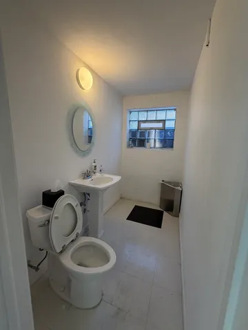a bathroom with a toilet and a sink