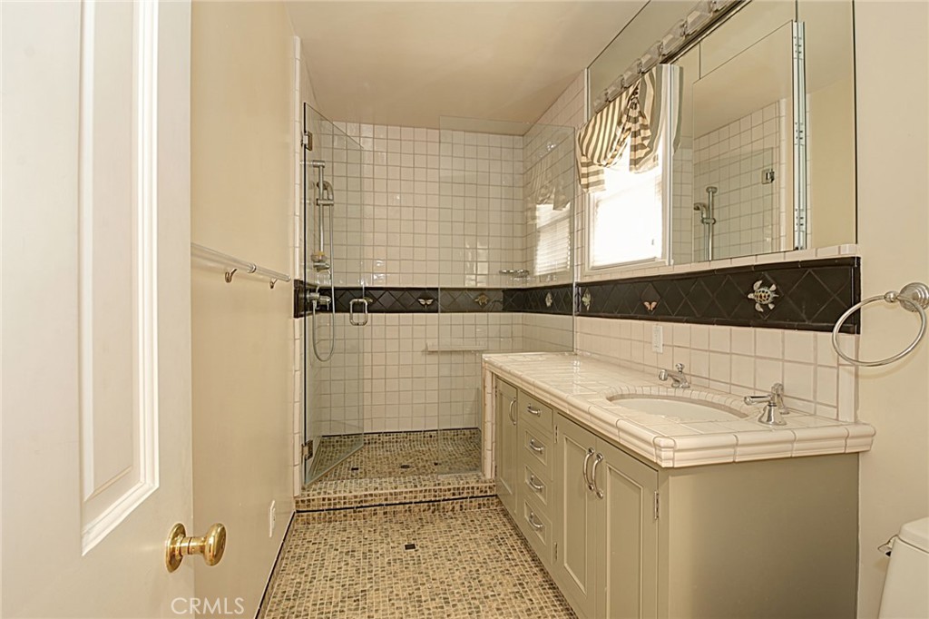 1300 Ramona Road Arcadia, CA 91006 - Photo 21 of 38 a bathroom with a sink and a mirror