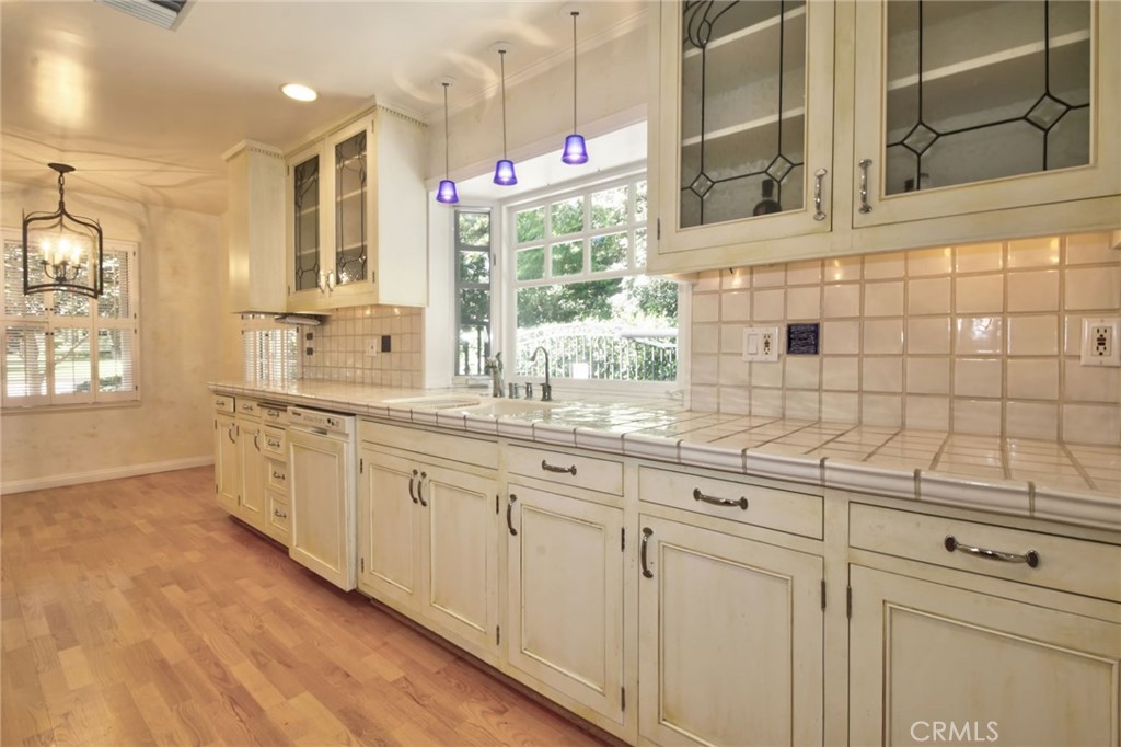 1300 Ramona Road Arcadia, CA 91006 - Photo 23 of 38 a bathroom with a double vanity sink a mirror and a shower