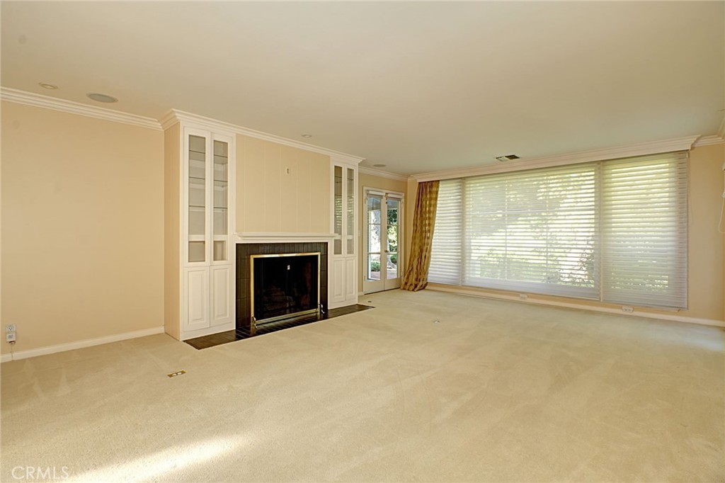 1300 Ramona Road Arcadia, CA 91006 - Photo 29 of 38 a view of an empty room with a fireplace and a window