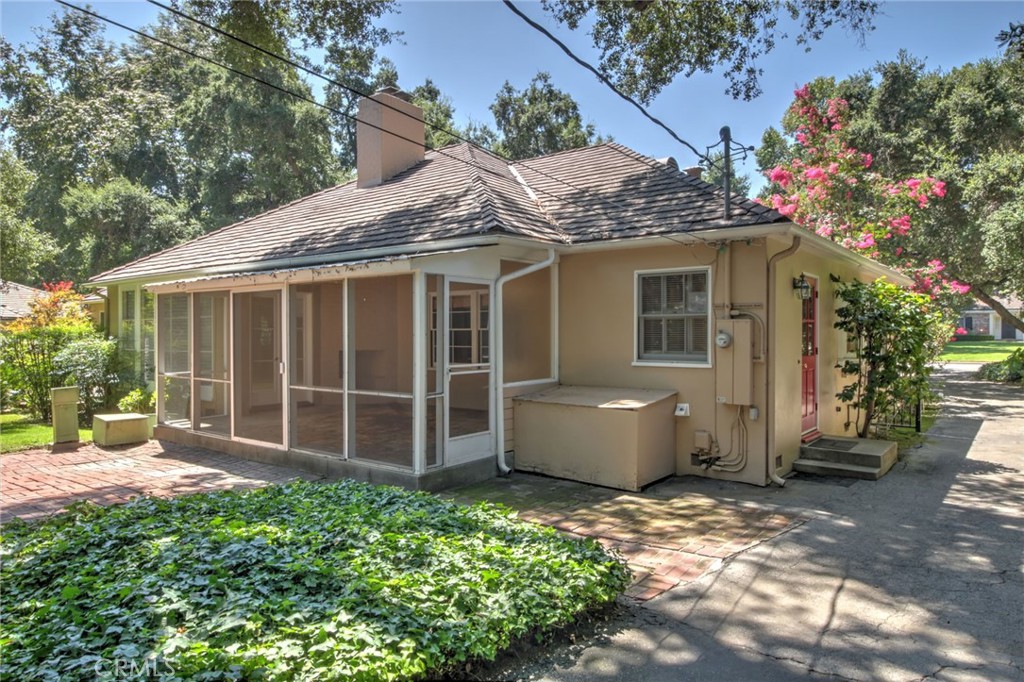 1300 Ramona Road Arcadia, CA 91006 - Photo 5 of 38 a view of a house with a large window and flower plants