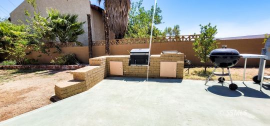 548 South Sanders Street Ridgecrest, CA 93555 - Photo 28 of 29 a view of a patio with couches and potted plants with sky view