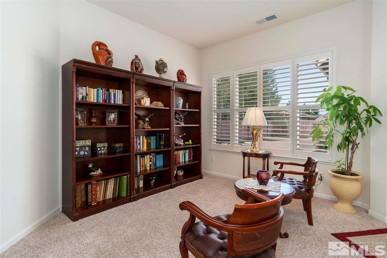 2645 Trail Rider Drive Reno, NV 89521 - Photo 15 of 25 a living room with furniture cabinets and a book shelf