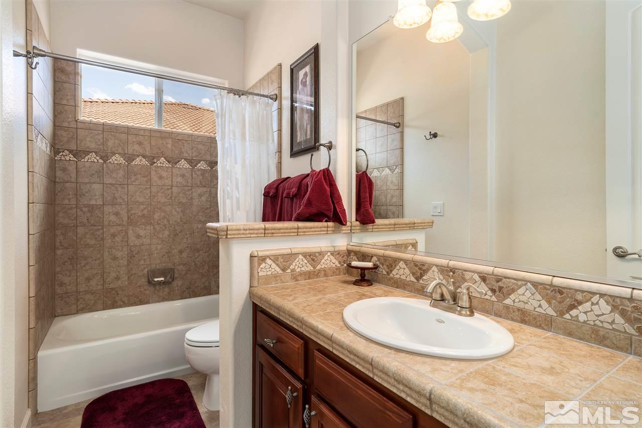 2645 Trail Rider Drive Reno, NV 89521 - Photo 16 of 25 a bathroom with a granite countertop sink toilet and shower
