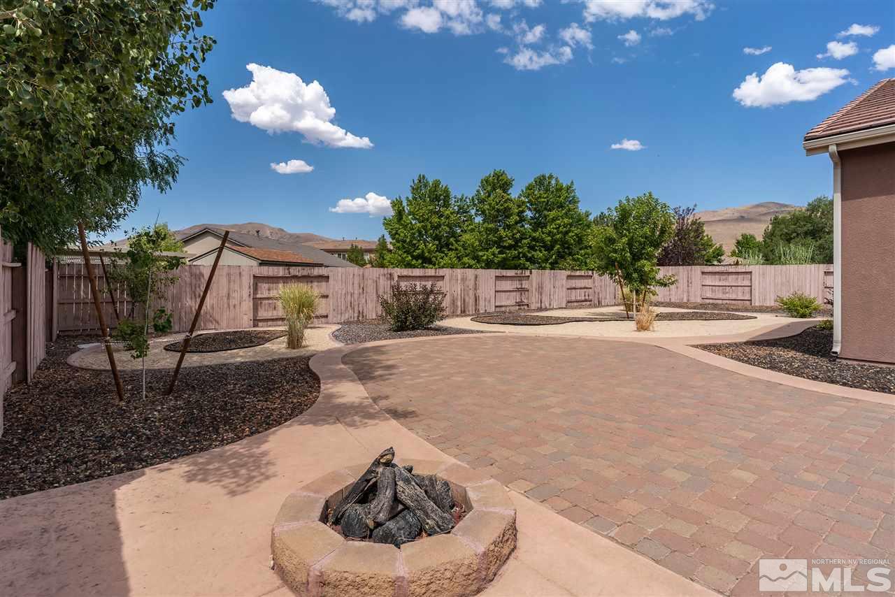 2645 Trail Rider Drive Reno, NV 89521 - Photo 5 of 25 a house view with a sitting space fire pit and outdoor space