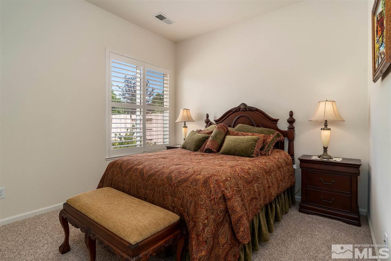 2645 Trail Rider Drive Reno, NV 89521 - Photo 8 of 25 a bedroom with a bed and a dresser