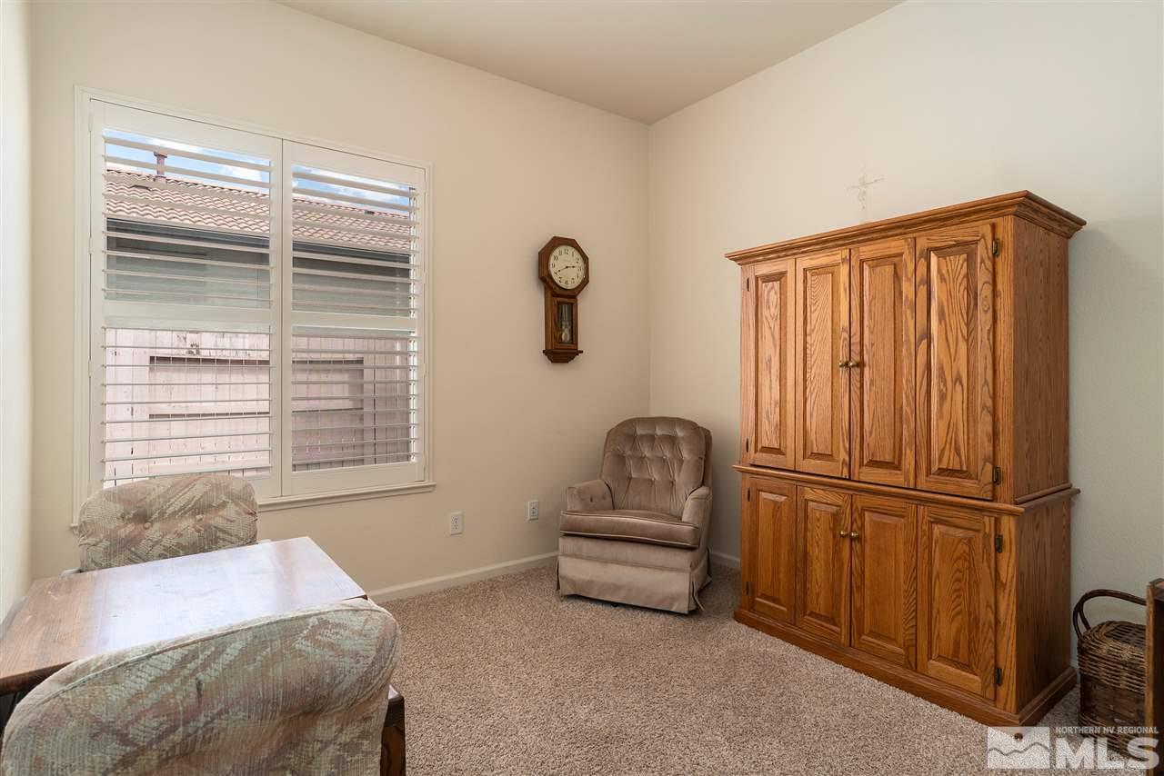2645 Trail Rider Drive Reno, NV 89521 - Photo 10 of 25 a bedroom with a bed and a window