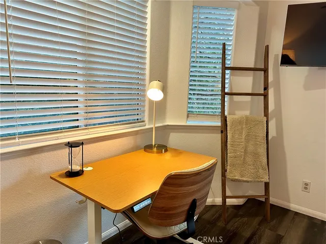 a room with pool table and a window