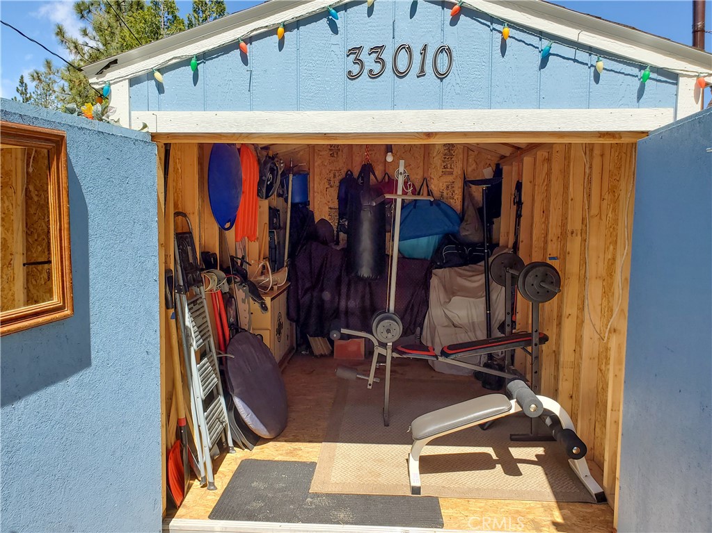 33010 Donner Lane Running Springs, CA 92382 - Photo 17 of 29 a view of a room with gym equipment