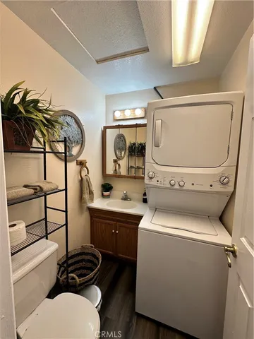 a bathroom with a toilet a sink and a mirror
