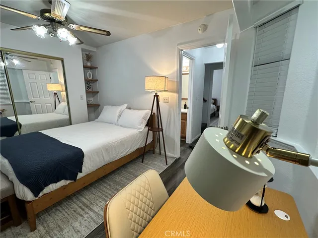 a bedroom with a bed and lamp