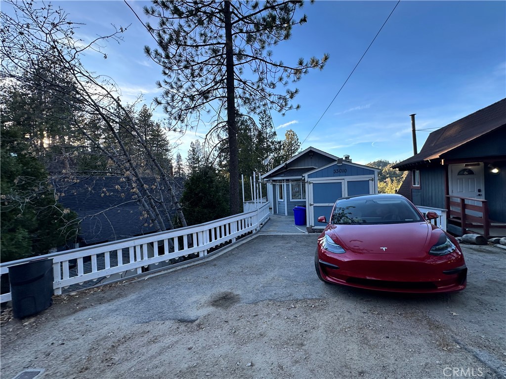 33010 Donner Lane Running Springs, CA 92382 - Photo 7 of 29 a front view of a house with garden