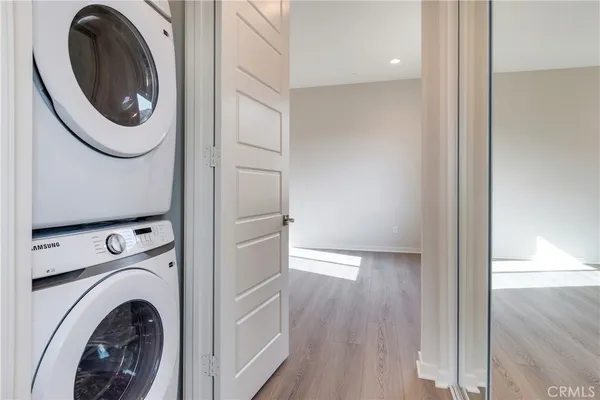 a view of a hallway with washer and dryer